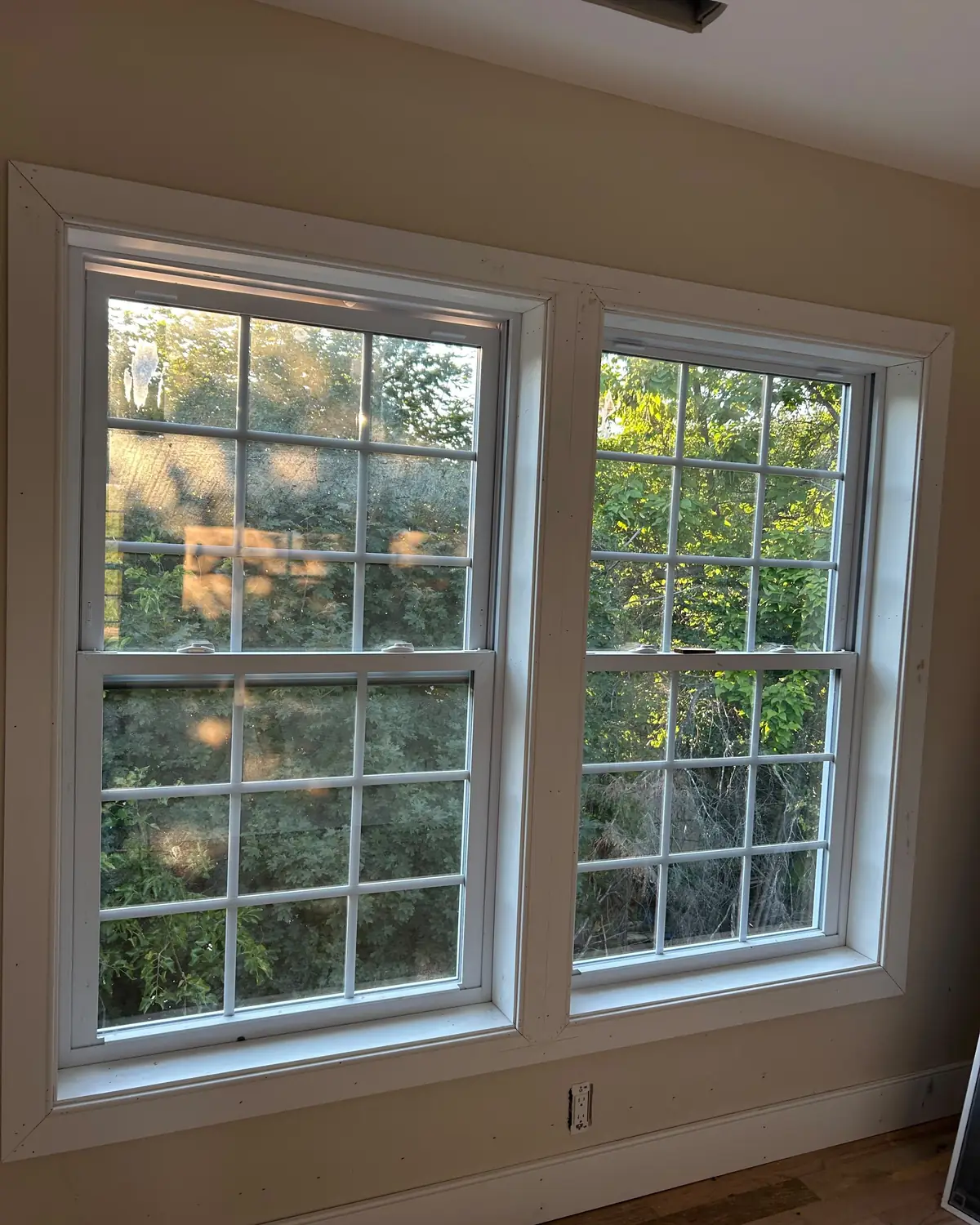 Pair of double hung windows trimmed out with new casing, sill and apron